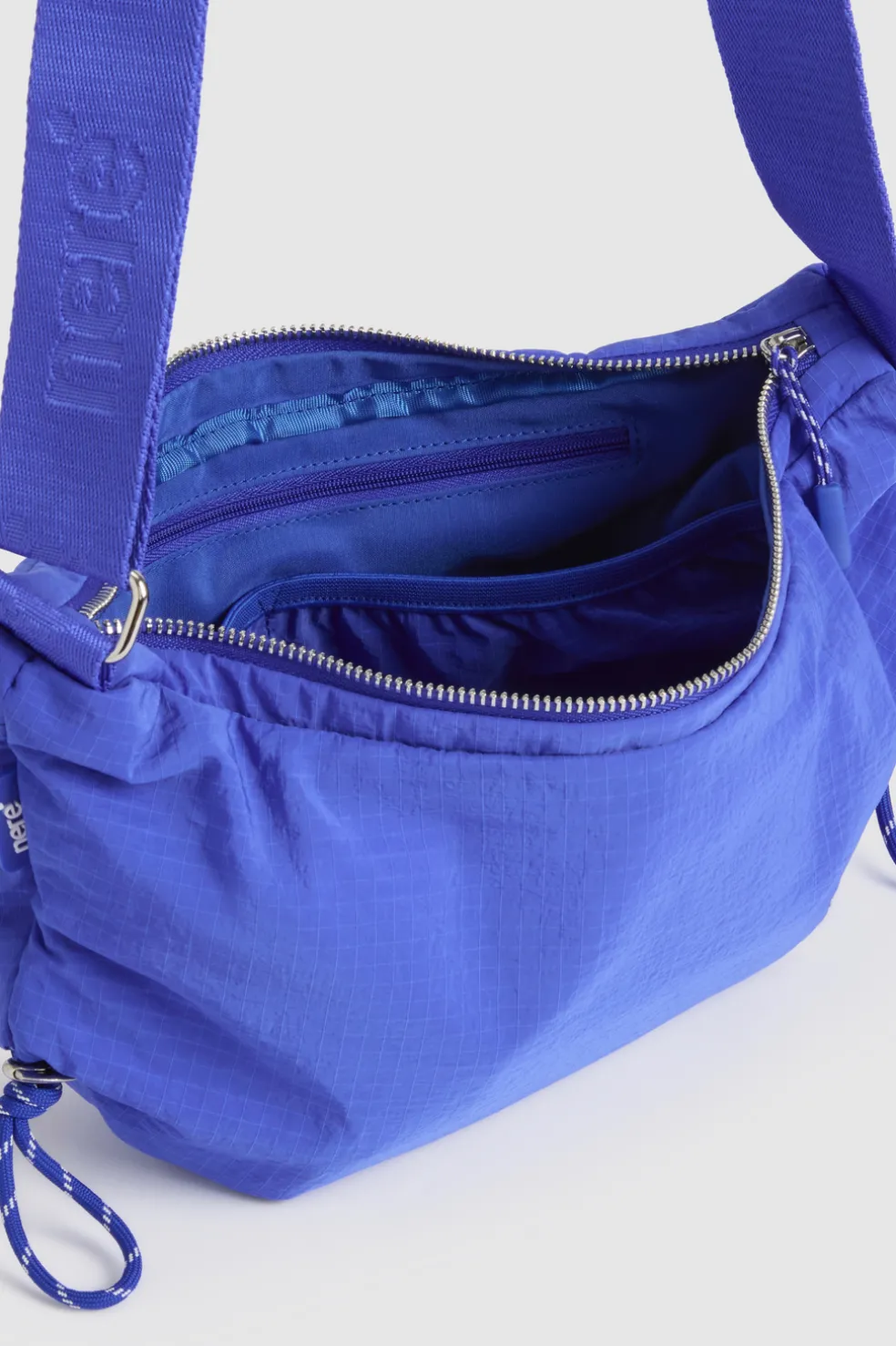 n.motion Crescent Sling Bag